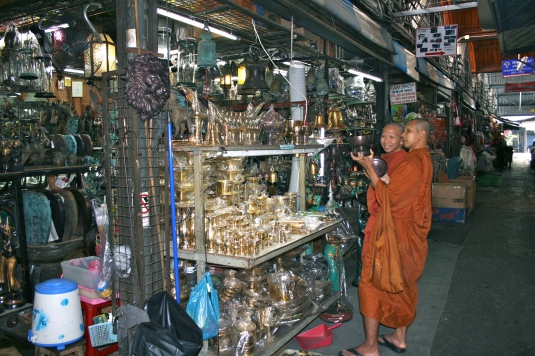 What do you mean you don't have it in Orange? Buddhist monks check out golden Mahlah statues and accessories for some reason